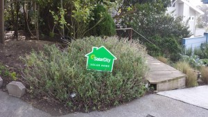 Photo courtesy of Jeff Leeds A SOLARCITY HOME: The front of Jeff Leeds house had this small promotional sign in 2012 after Leeds said he bought into a sales pitch.