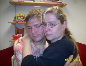 Kathy hugs her son goodbye at their final visit. Source: Butner family.